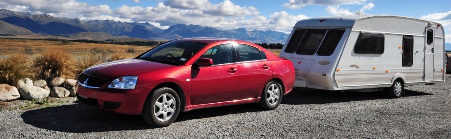 Car pulling trailer thanks to one of our tow bars in Lower Hutt